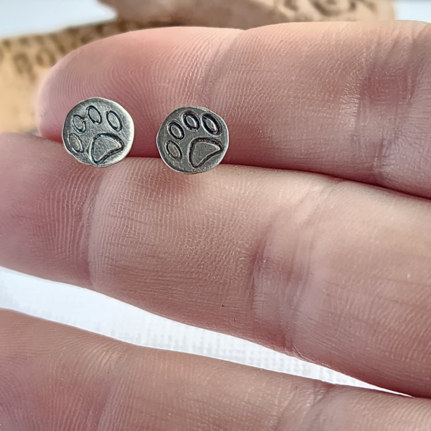 Sterling silver paw print stud earrings